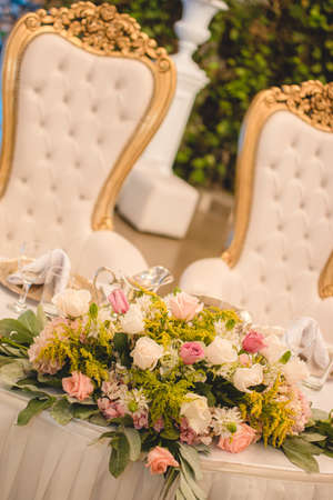Table decoration with newly married flowers in the banquet area at the wedding party.の写真素材