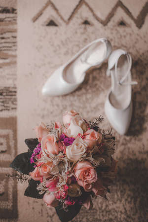 Bridal bouquet and shoes, wedding conceptの写真素材