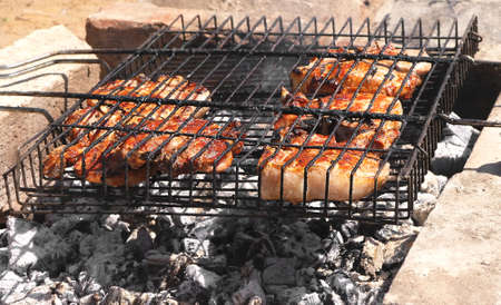 Meat grilled barbecue on charcoalの写真素材