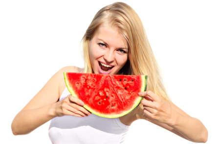 Young Woman eating big slice Watermelon Berry fresh in hands Beautiful Smiling Face and Blonde Hair Organic Food concept isolated on white backgroundの写真素材