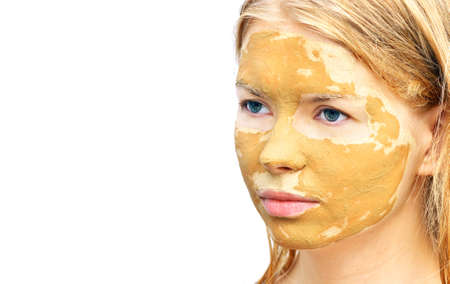 Spa Woman Face with facial Clay Mask Organic Beauty treatments Skin Care isolated on white backgroundの写真素材