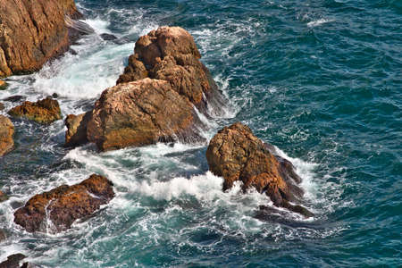 Stones in the Sea deep blue with waves Beautiful Landscapeの写真素材