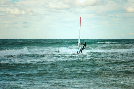 Sea Windsurfing Sport sailing water active leisure Windsurfer training on waves summer dayの写真素材