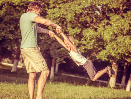 Family Father Man and Son Boy playing Outdoor Happiness emotions Lifestyle with summer nature の写真素材