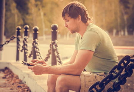 Man with Tablet PC Outdoor Young Businessman Technology concept Lifestyle with summer nature on backgroundの写真素材