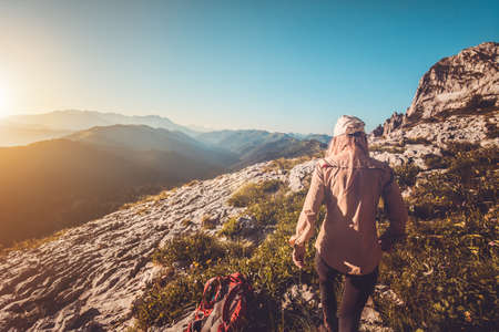 Young Woman hiking outdoor Travel Lifestyle concept mountains on background Summer journey vacationsの写真素材