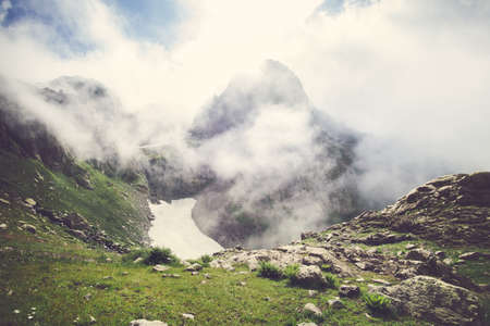 Rocky Mountains foggy Landscape with clouds and green valley Summer Travel serene scenic viewの写真素材