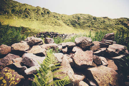 Mountains green valley with ancient stones fence Landscape Travel scenic viewの写真素材