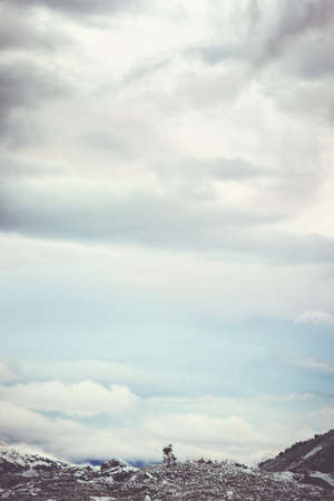 Minimalistic Landscape of Sky clouds and mountains background Travel serene scenic bird eye aerial viewの写真素材