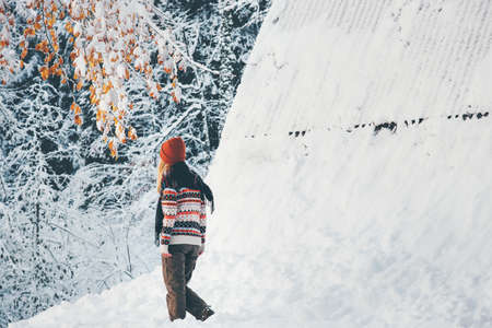 Woman walking alone in winter forest Travel Lifestyle adventure concept active vacations outdoorの写真素材