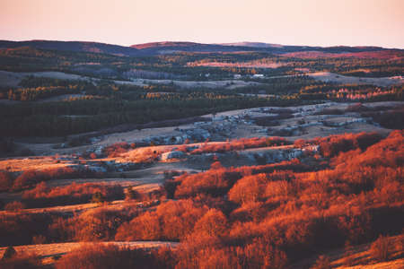 Aerial Sunset view of Mountains plateau area with forest natural sunset red colors Travel sceneryの写真素材