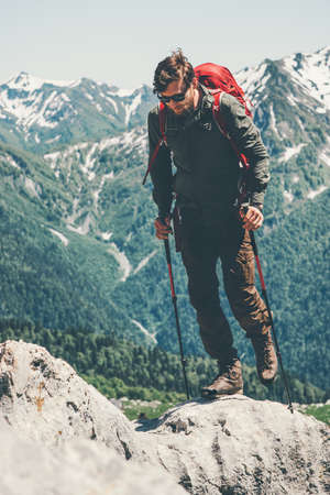 Man traveler with backpack hiking in mountains Travel Lifestyle concept adventure active vacations outdoor into the wildの写真素材