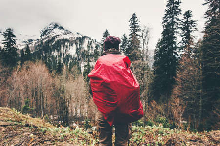 Traveler Woman hiking in forest mountains Travel Lifestyle concept adventure vacations outdoor mountaineering sport active leisure into the wildの写真素材