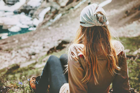 Woman relaxing in mountains Travel Lifestyle wanderlust concept summer vacations outdoor harmony with natureの写真素材
