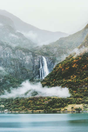 Fog Mountains and waterfall Landscape in Norway Travel scenic view moody weatherの写真素材