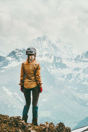 Young woman hiking alone enjoying mountains landscape Travel lifestyle adventure concept active summer vacations outdoor の写真素材