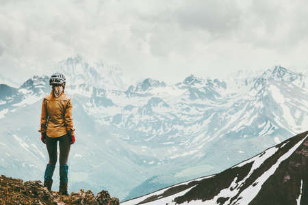 Woman climber enjoying snowy mountains view Travel lifestyle adventure concept active vacations outdoor の写真素材