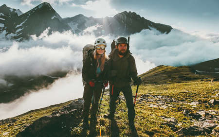 Traveling Couple climbing together in mountains love and adventure Lifestyle wanderlust friendship concept outdoor
の写真素材