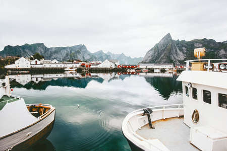 Lofoten islands landscape mountains reflection in sea water and ships scandinavian travel nature scenic view in Norwayの写真素材