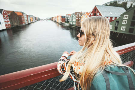 Traveler blonde woman sightseeing Trondheim city on bridge in Norway Lifestyle vacations outdoor scandinavian landmarks architecture の写真素材