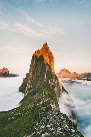 Segla Mountain sunset peak Landscape over clouds and fjord view in Norway Travel location scenery Senja islands の写真素材