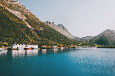 Husoy village in Norway mountains and sea fjord landscape Travel locations scandinavian scenery Senja islands の写真素材