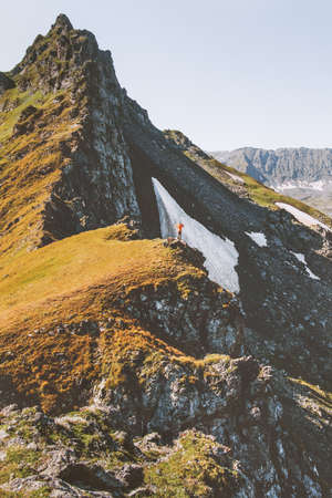 Man climbing mountains adventure active lifestyle traveling summer vacations outdoor の写真素材