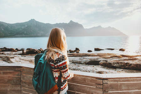 Woman enjoying sea view traveling with backpack active healthy lifestyle adventure summer vacations outdoor の写真素材