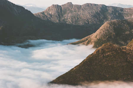 Sunset mountains over clouds landscape aerial view travel in Norway idyllic scenery の写真素材