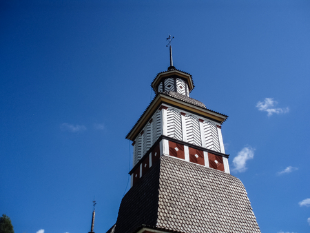 Old wooden church in Scandinavian style on a summer dayの写真素材