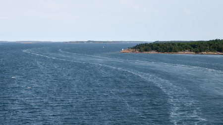 S Curve Wake along the skerries at Baltic Seaの写真素材