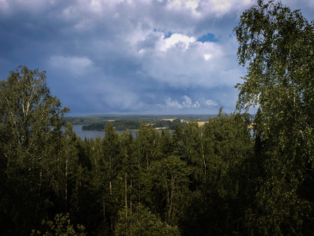 Scenery of the finnish lakes in summer surrounded by deep green forestsの写真素材