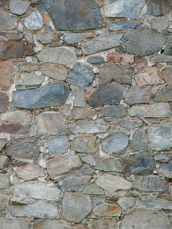 Stone wall texture - Rough big stones of different colors - Usage for old walls or roadsの写真素材