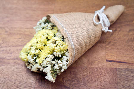 Dried flower bouquet on wood tableの写真素材