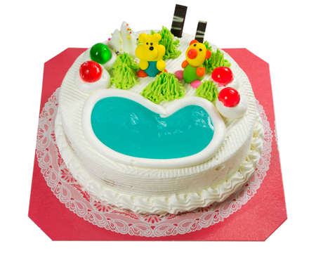 Fancy cake with sugar cartoon and jelly heart isolated on white backgroundの写真素材