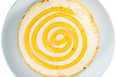 Cake with spiral jam on top closeup and isolated on white backgroundの写真素材
