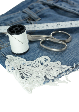 Jeans diy with lace decorated isolated on white backgroundの写真素材