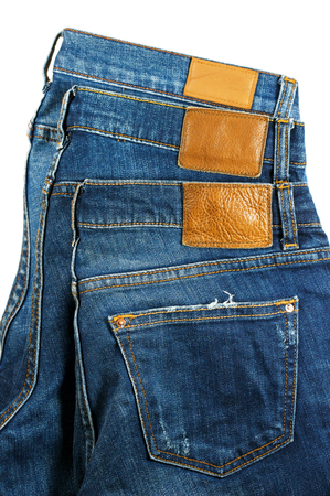 Jeans with leather label and pocket isolated on white backgroundの写真素材