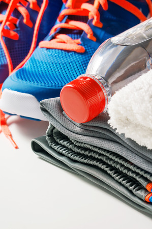 Fitness gym accessories with drinking water and sport clothing and shoesの写真素材