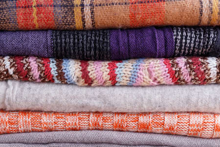 Stack of folded colorful scarf closeup textureの写真素材