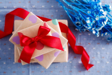 Gift boxes for holiday with red ribbon top viewの写真素材