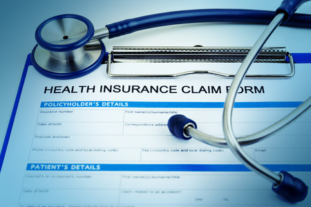 Health insurance claim form with stethoscopeの写真素材