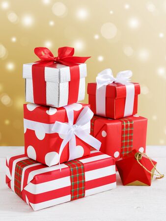 Gift boxes and present for christmas with gold backgroundの写真素材
