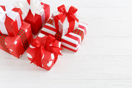 Gift boxes with ribbons on wood table backgroundの写真素材