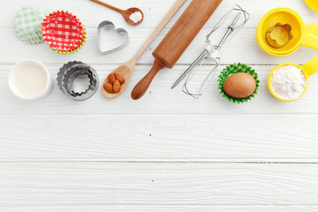 Baking background with ingredients and baking utensils