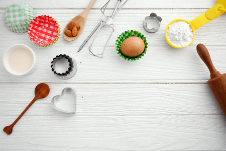 Baking background with baking ingredients and tool on wooden tableの写真素材