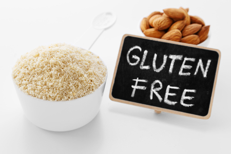 Almond flour with gluten free sign on white backgroundの写真素材