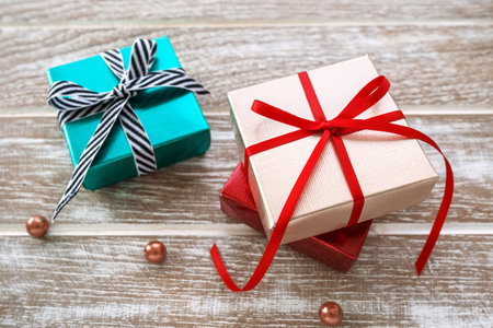 Gift box and christmas present on wooden table