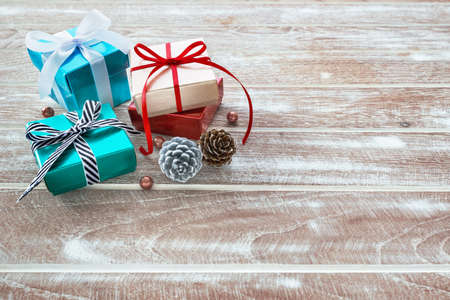 Christmas background with gift box and present on wooden table with copy spaceの写真素材