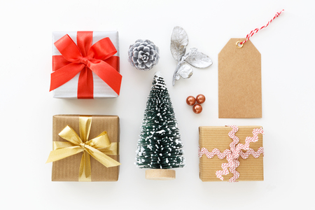 Gift boxes and christmas decoration with tag on white backgroundの写真素材